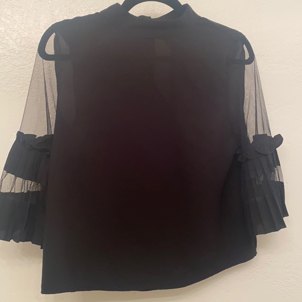 Black blouse.